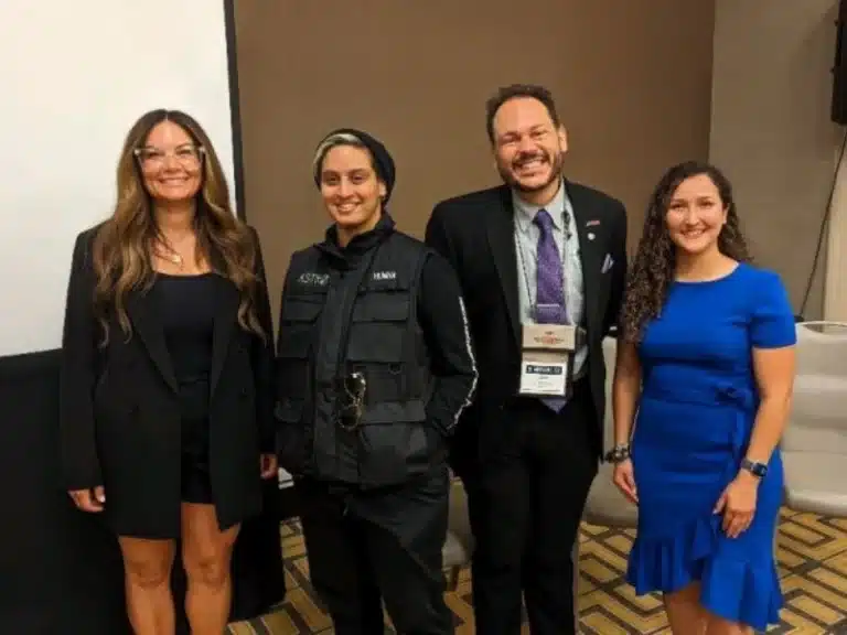 Diverse panel of industry leaders and innovators at a manufacturing and technology conference, showcasing leadership in additive manufacturing and engineering advancement.